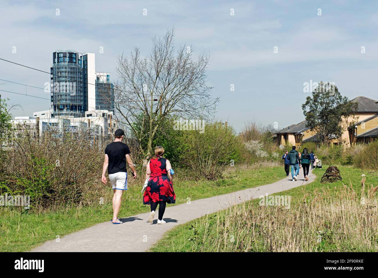 Park or Parkland Walk Extension Gillespie Park with people walking along the path in the spring sunshine Highbury, London Borough of Islington Stock Photo