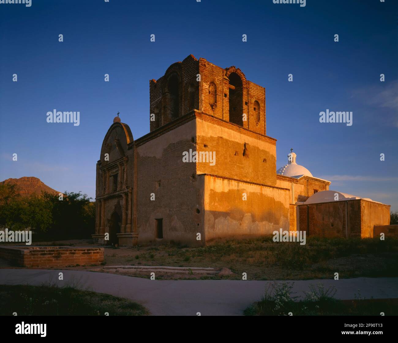 Tumacacori National Monument  AZ / APR First light warms Kino Mission San Jose Tumacacori in southern Arizona. Stock Photo