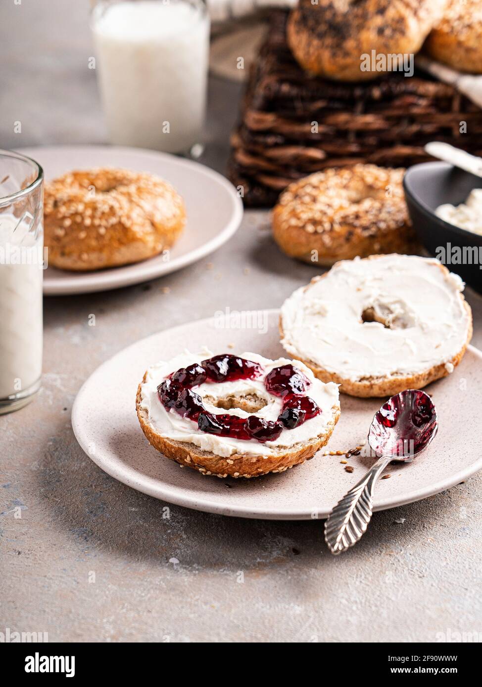 Bagel with cream cheese and jam Stock Photo Alamy