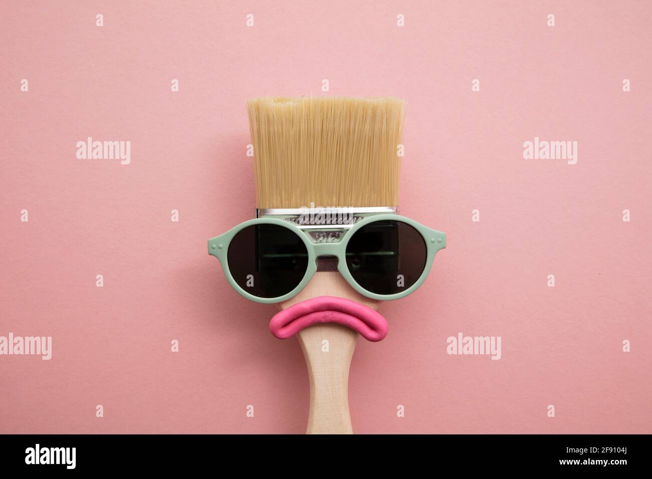 Paint brush diy character with sunglasses and sad face Stock Photo