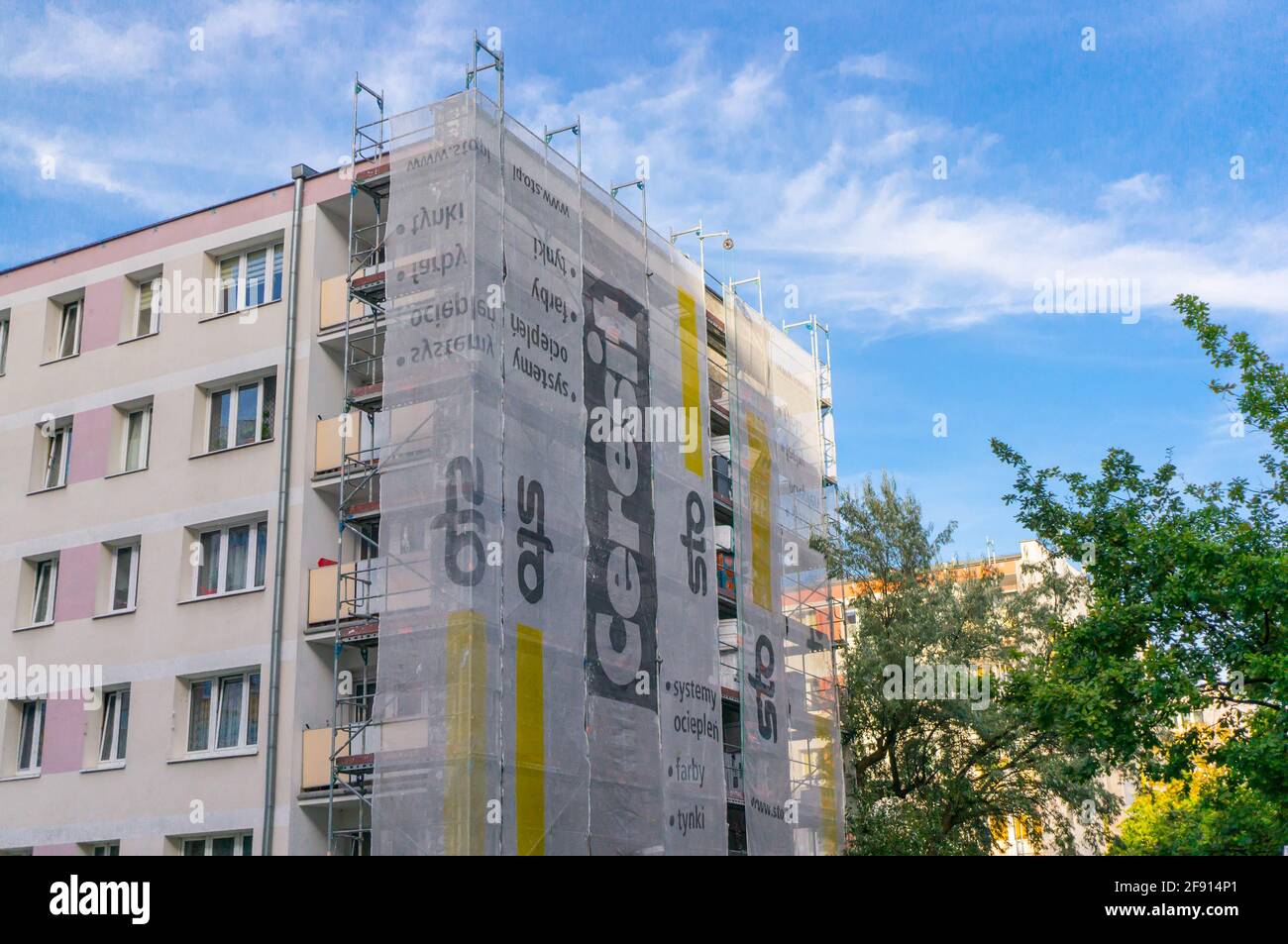 POZNAN, POLAND - Oct 19, 2015: Apartment building under renovation with Ceresit advertisement at the Osiedle Piastowskie area Stock Photo