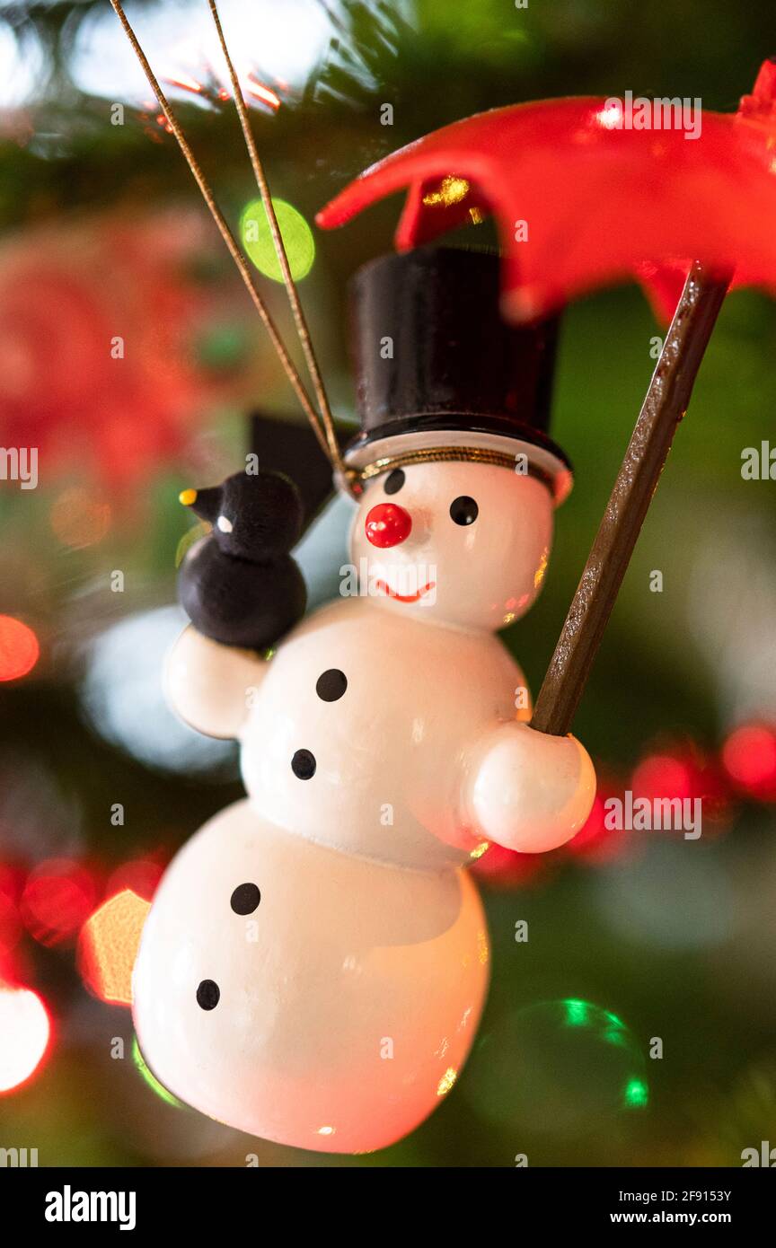 snowman Christmas ornament on a tree Stock Photo