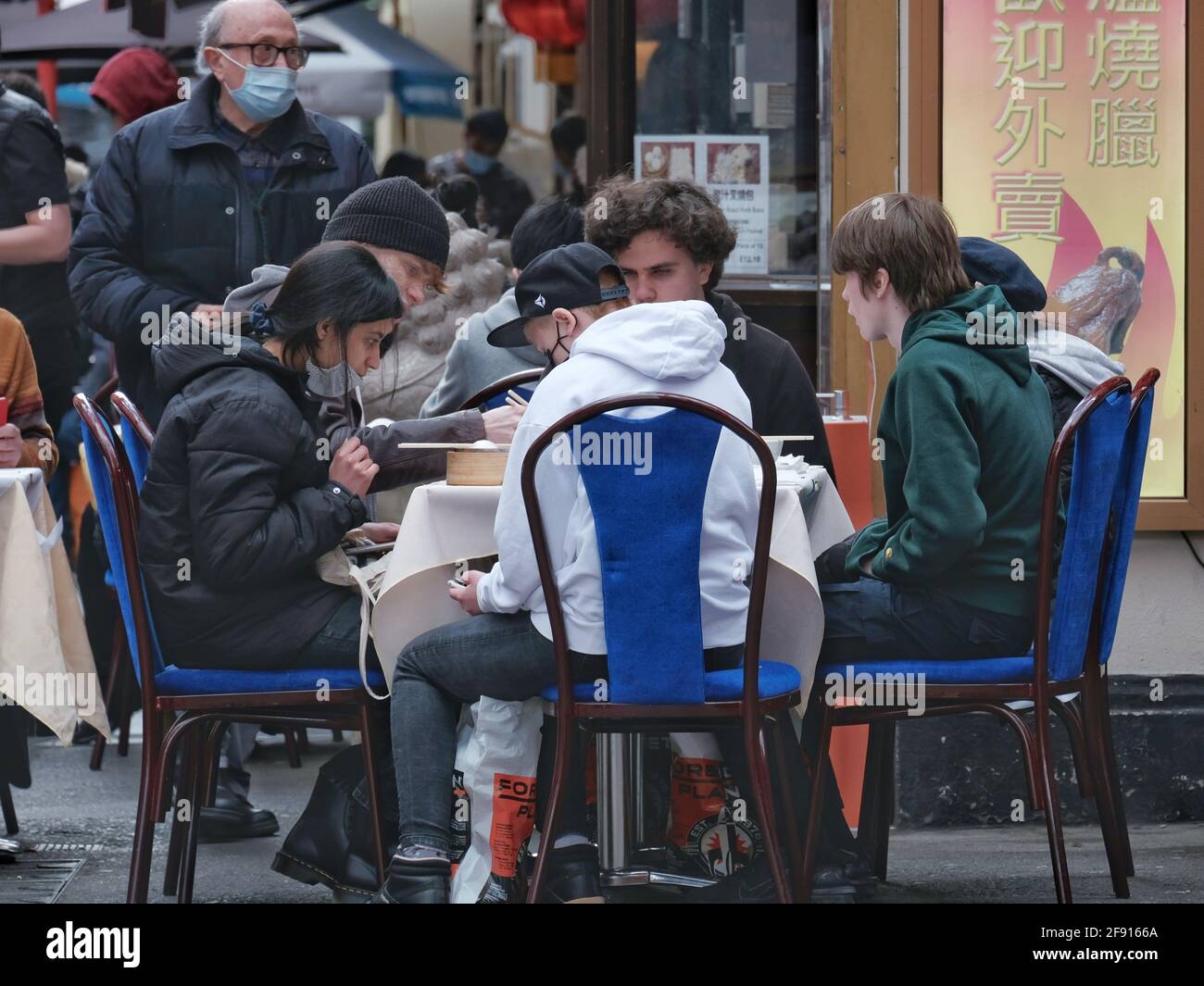 Diners in London's Chinatown enjoy a meal out on the first day outdoor hospitality returns as Covid restrictions are further eased in England Stock Photo