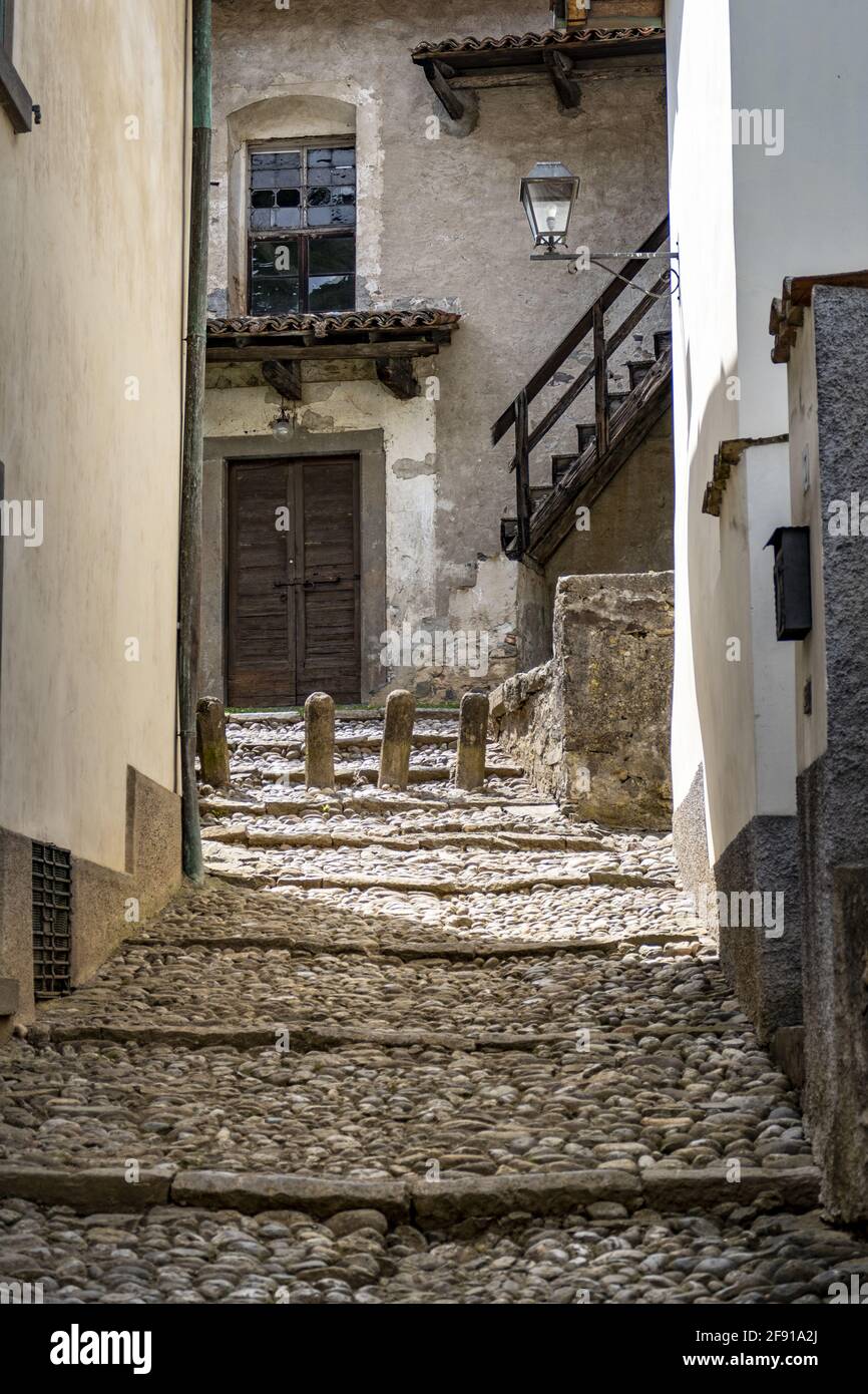 Rocky walkway and part of an old house in Cornello dei Tasso, ancient medieval village, Italy Stock Photo