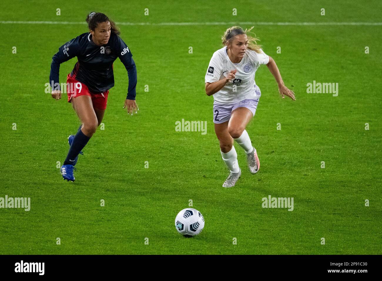 Washington, USA. 15th Apr, 2021. Washington Spirit defender Tegan McGrady chases Racing Louisville FC forward Katie McClure during a National Women's Soccer League (NWSL) Challenge Cup match between the Washington Spirit and Racing Louisville FC, in Washington, DC, on April 15, 2021. The Challenge Cup match ended in a 1-0 Washington win, after a stoppage time goal from an Ashley Sanchez volley off a Trinity Rodman cross. (Graeme Sloan/Sipa USA) Credit: Sipa USA/Alamy Live News Stock Photo