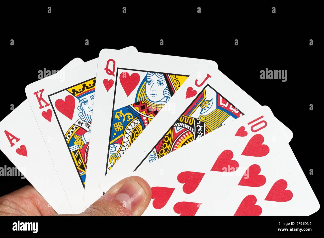 Ace of clubs, king of diamonds, queen of spades, and jack of hearts playing  cards on wood table Stock Photo - Alamy