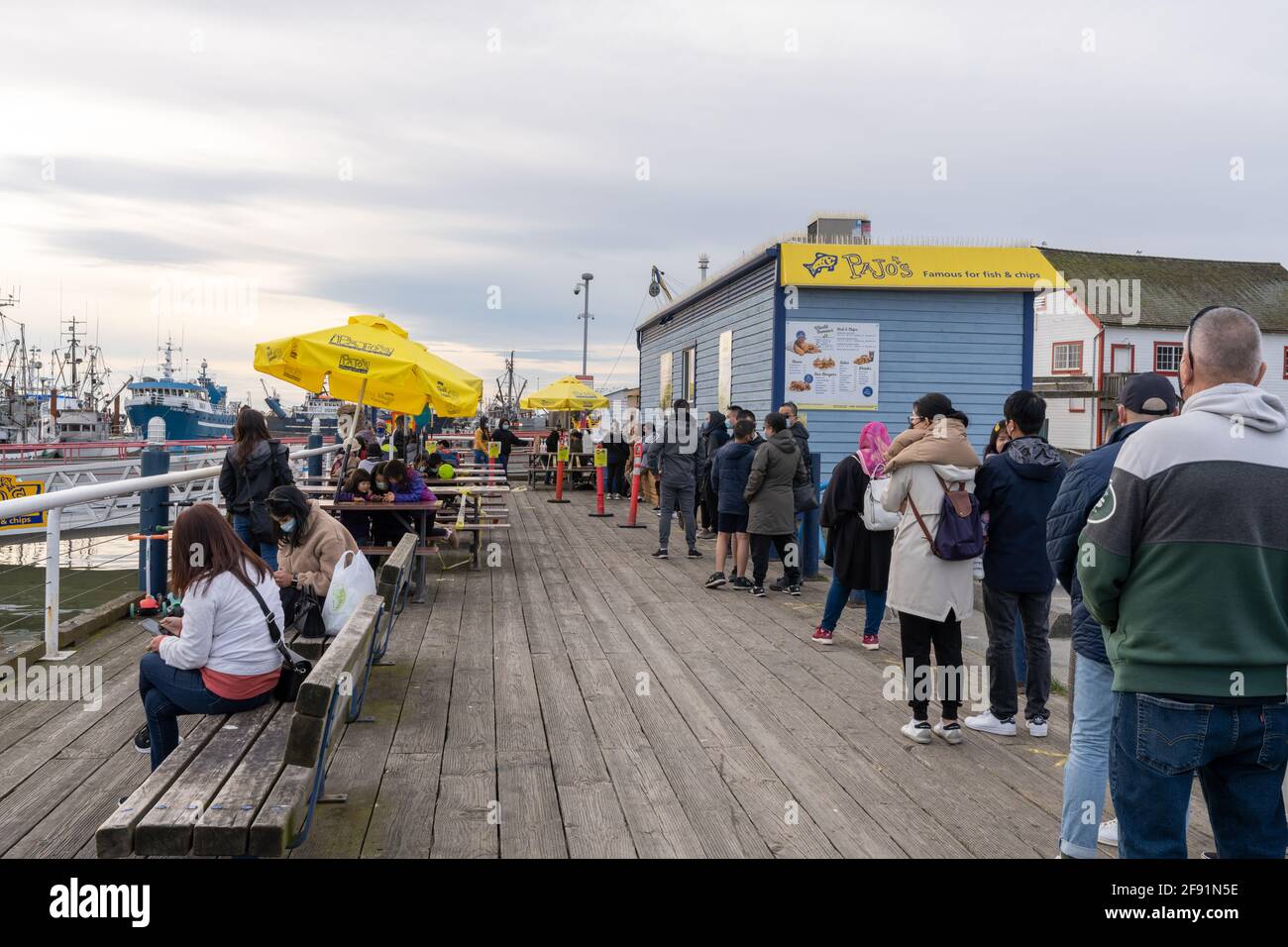 Steveston Harbour Fisherman's Wharf. People line up to buy famous Pajo's Fish and Chips food. Stock Photo