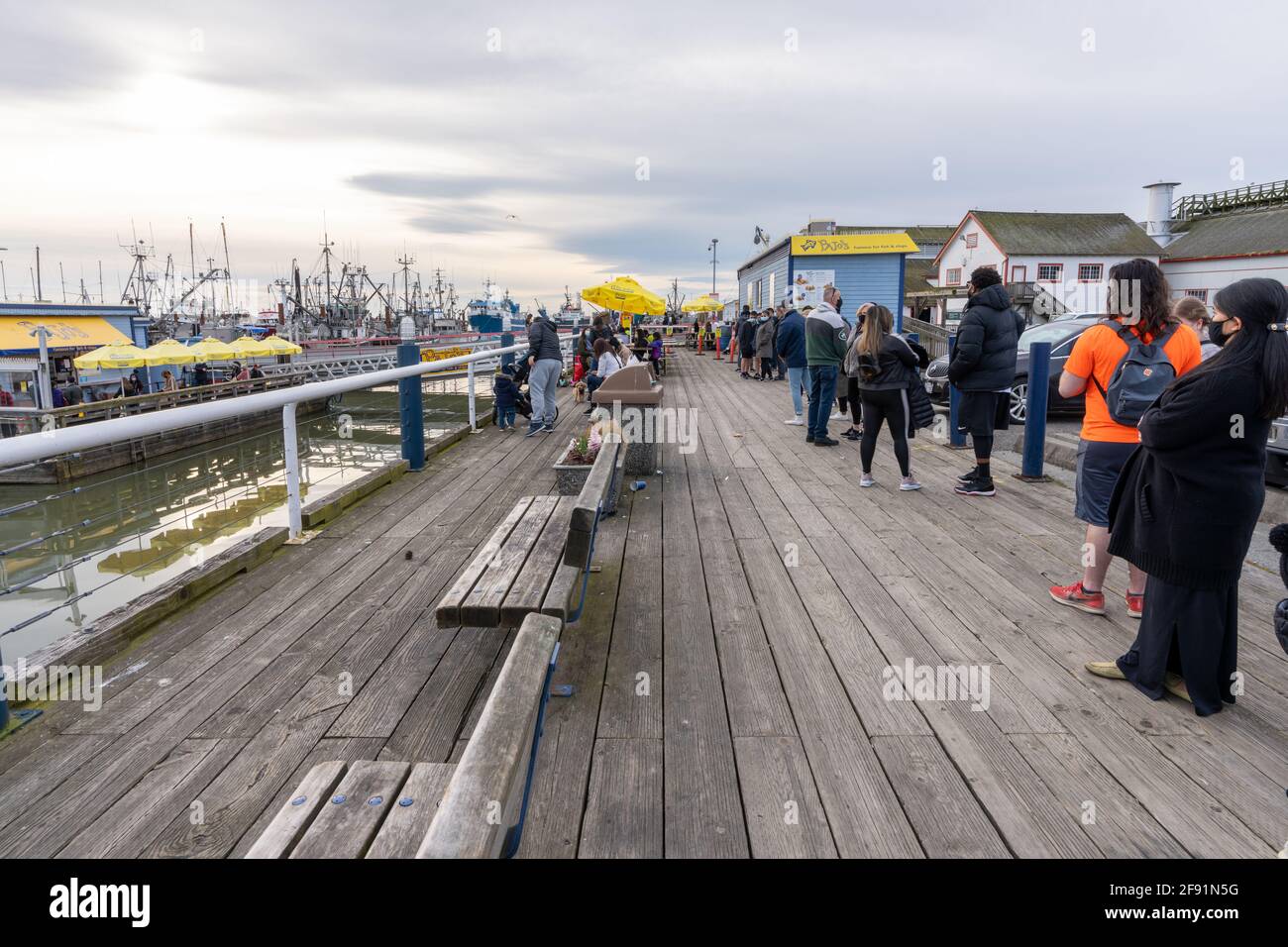 Steveston Harbour Fisherman's Wharf. People line up to buy famous Pajo's Fish and Chips food. Stock Photo