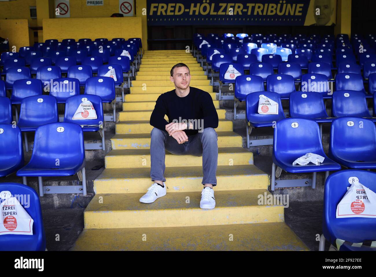 Hamburg, Germany. 15th Apr, 2021. Jadrian Clark, quarterback Hamburg Sea  Devils in the European League of Football (EFL), sits in the stands at the  Hoheluft stadium during a photo session. The Hamburg