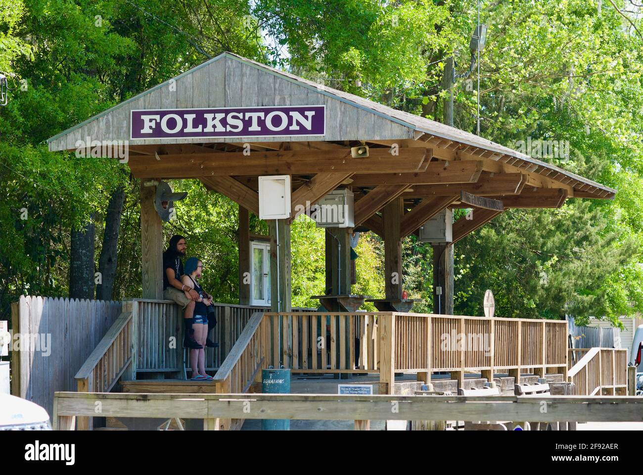 Folkston, George, USA - April 5, 2021: A couple await trains to pass through the 'Folkston Funnel' at the 'Folkston Funnel Platform' for rail fans. Stock Photo