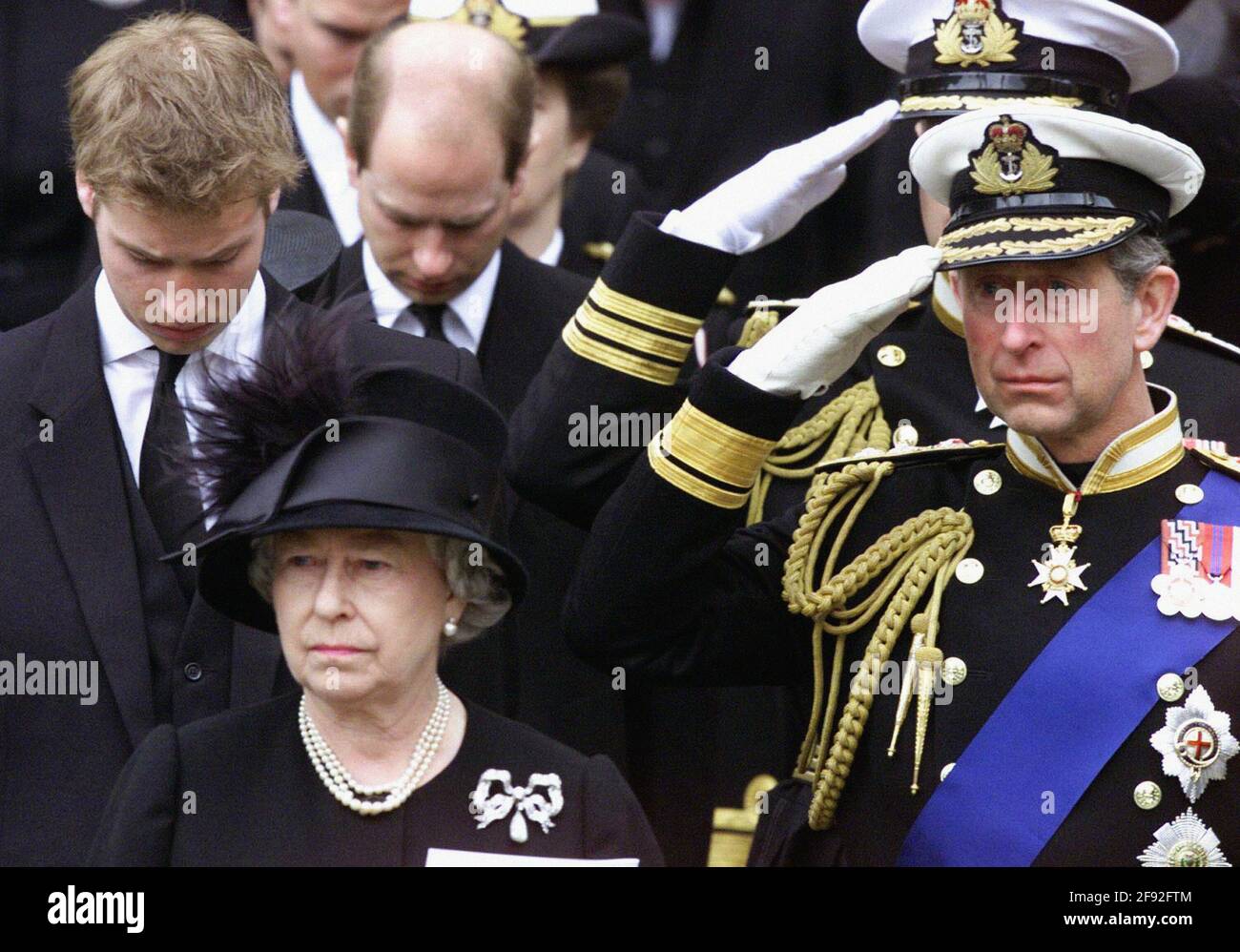 File photo dated 09/04/02 of Queen Elizabeth II, watching as the coffin containing the body of the Queen Mother is put into a hearse following her funeral service at Westminster Abbey, London. The monarch addressed the nation on the eve of her mother???s funeral to thank the country for their support and the love and honour shown to the 101-year-old. Issue date: Friday April 16, 2021. Stock Photo