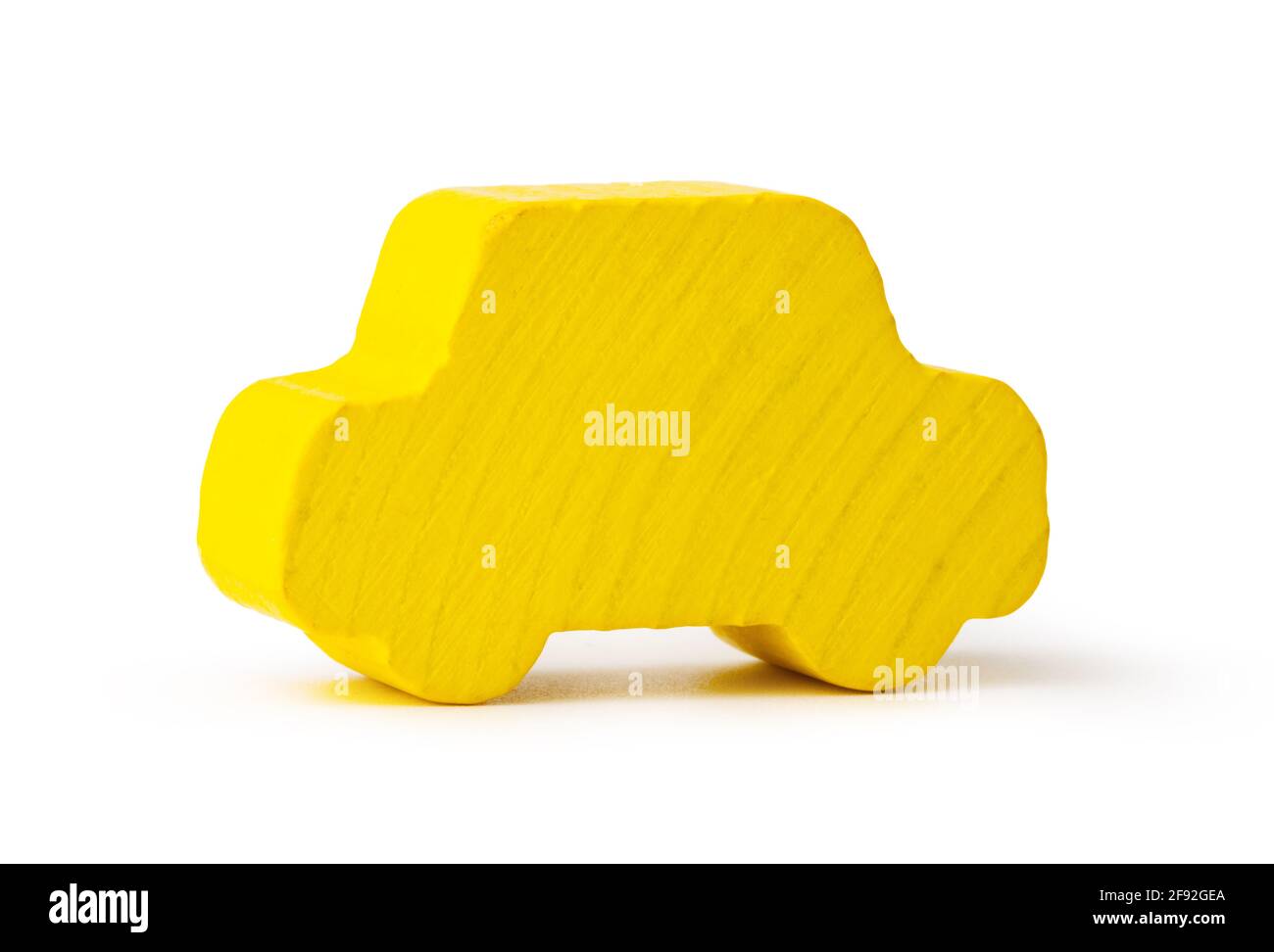 Wooden toy figure of a car isolated on white Stock Photo - Alamy
