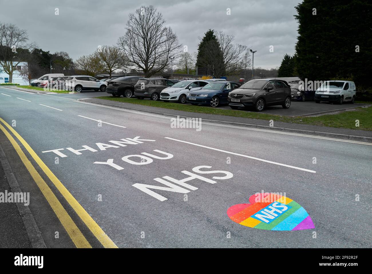 'Thank you NHS' painted on the road into the medical centre at Corby, England. Stock Photo
