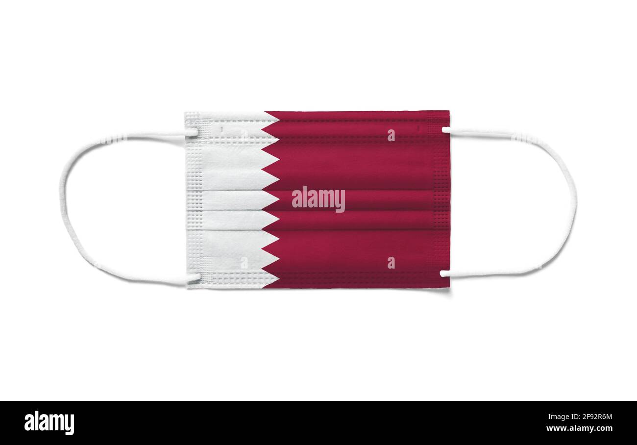 Flag of Qatar on a disposable surgical mask. White background isolated
