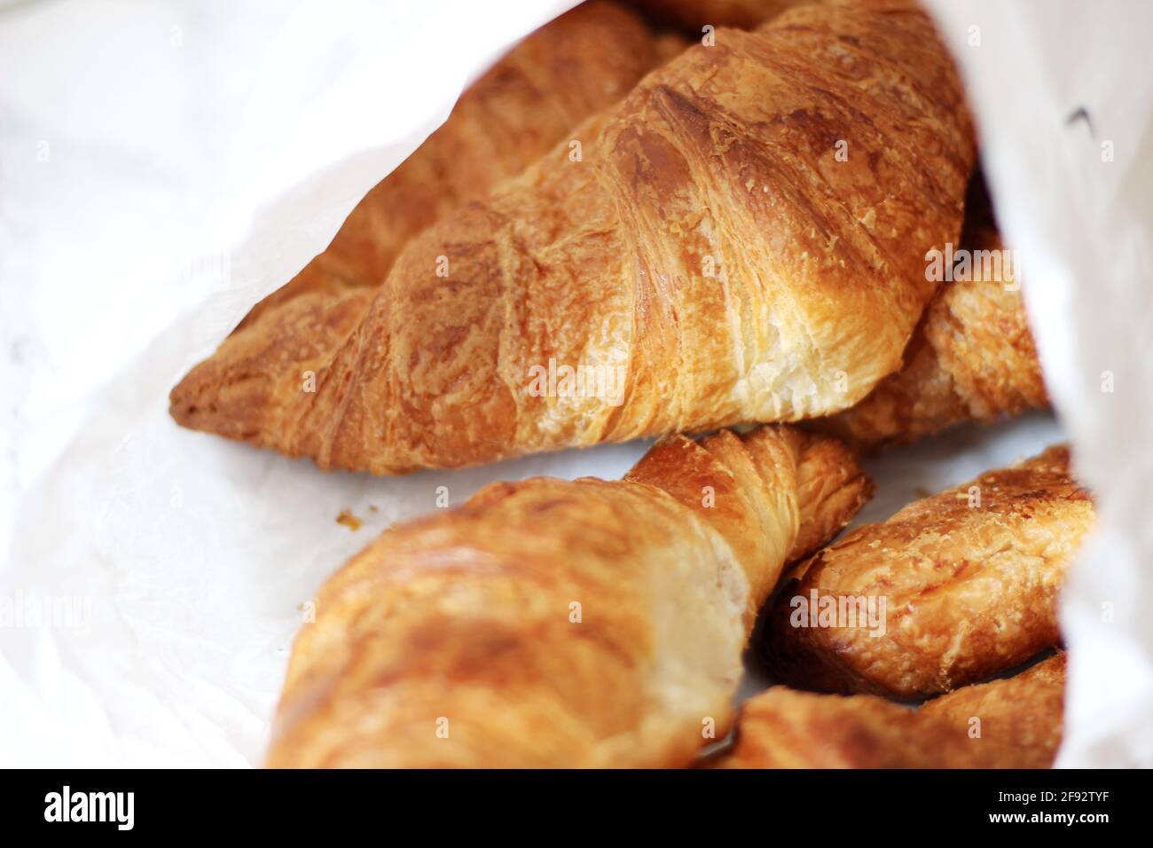 Freshly Baked Croissants from Parisian Bakery. Traditional French Breakfast Pastries. Artisanal Bakery in Paris, France. Stock Photo