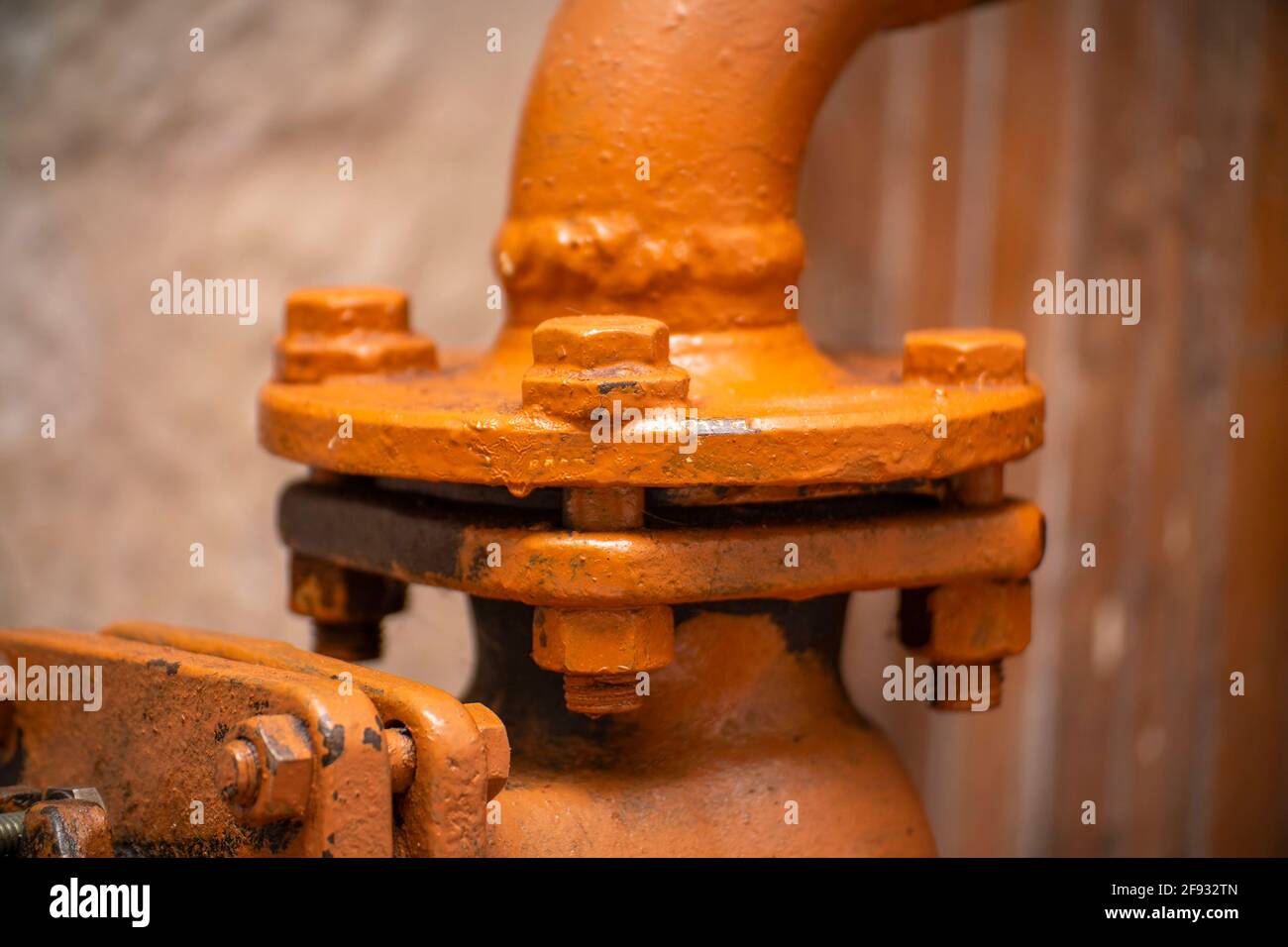 The flange connection is bolted on a metal painted pipe. Flange on the
