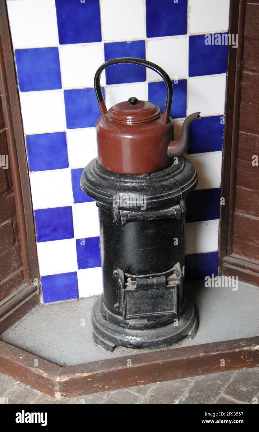 A Vintage Wood Stove and Kettle in an Old Kitchen Stock Photo Alamy