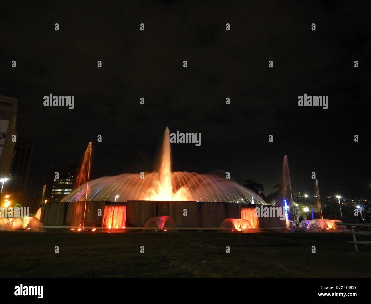 Fountains in a park in the nighttime Stock Photo - Alamy