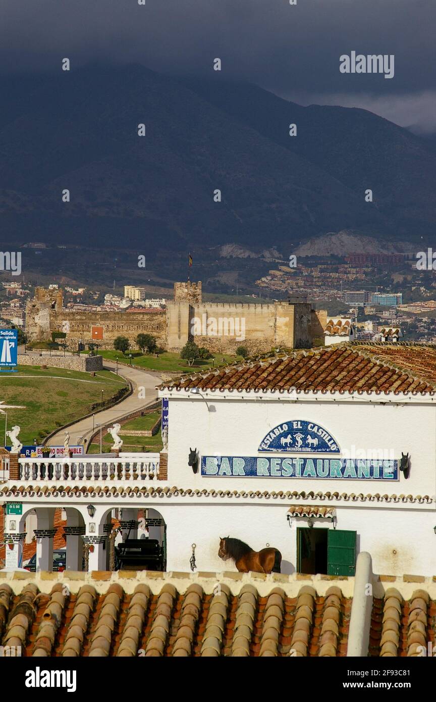 Weather over Sohail castle in Fuengirola, Spain. Province of Malaga, Andalusia, on the Costa del Sol. Establo el Castillo, stable, bar restaurant Stock Photo