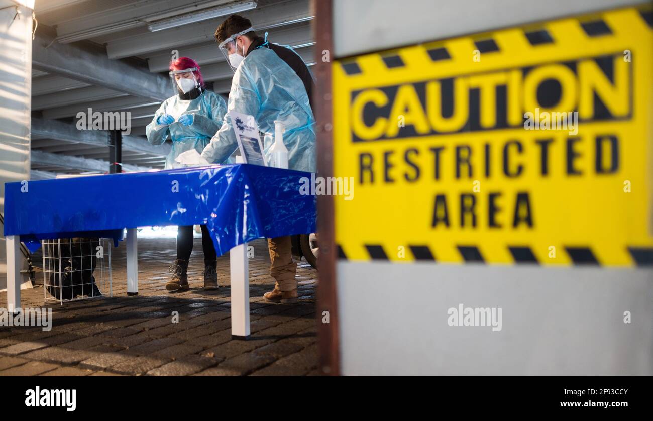 Hanover, Germany. 16th Apr, 2021. Helpers prepare Corona rapid tests at the 'Testzentrum am Zoo'. The Robert Koch Institute (RKI) continues to report an increase in new Corona infections in Germany. Credit: Julian Stratenschulte/dpa/Alamy Live News Stock Photo
