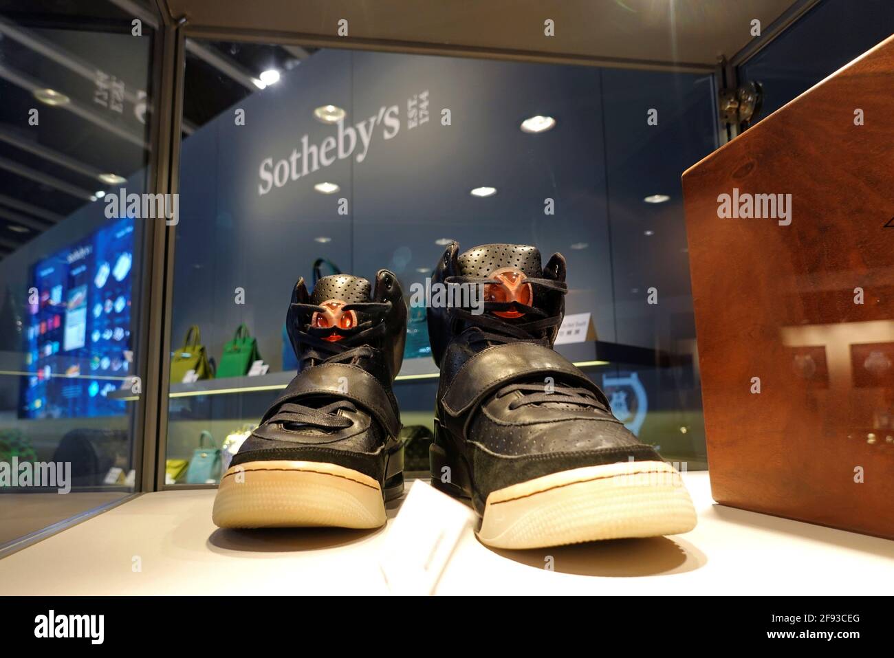 A pair of 'Nike Air Yeezy 1' prototype sneakers designed by Kanye West, are  displayed at the Hong Kong Convention and Exhibition Centre before going up  for private sale at Sotheby's, in