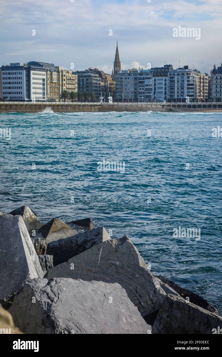 San Sebastian, Spain - April 2, 2021:  Harbour walls and views across La Concha bay from old town San Sebastian Stock Photo