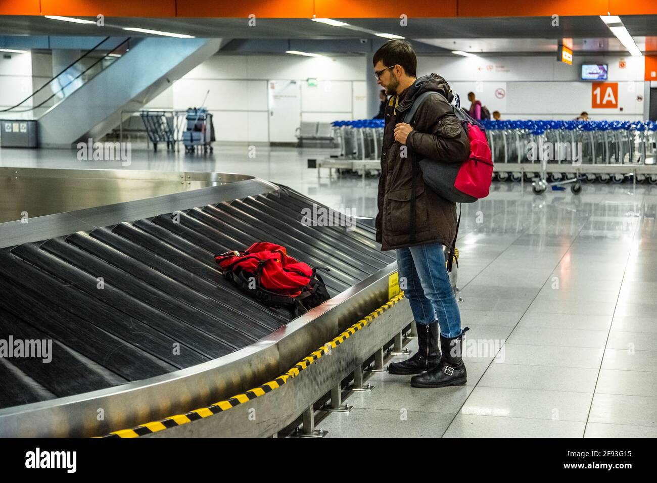 The tourist is going to take his luggage at the airport Stock Photo Alamy