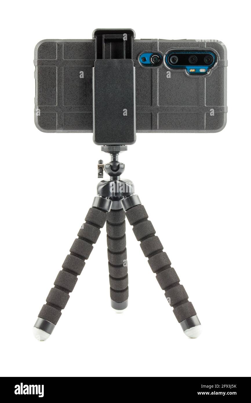 black cellphone in rugged rubber protective cover on small flexible tripod isolated on white Stock Photo