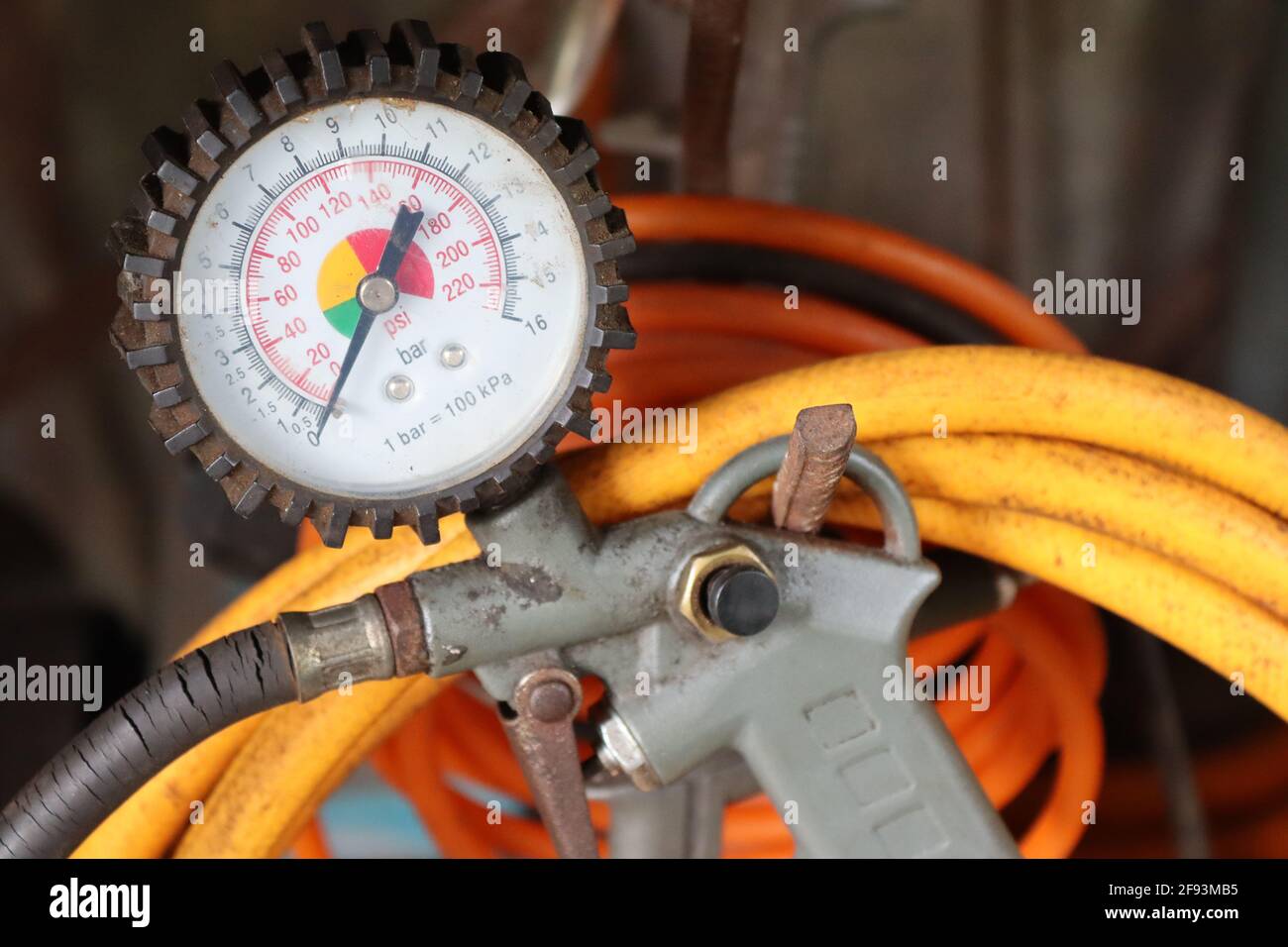 Air supply meter for vehicle tyres in a home garage. Stock Photo