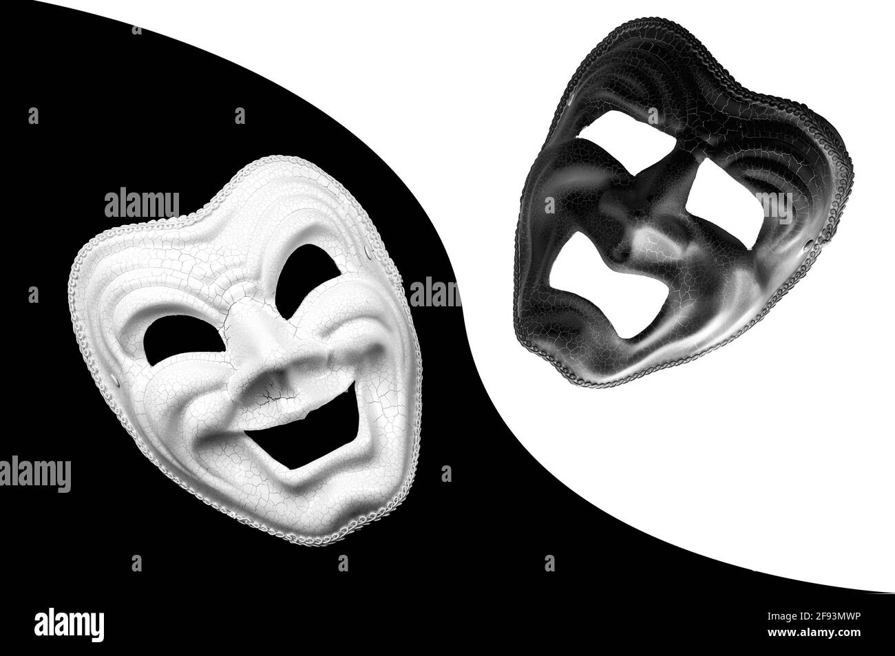 Yin and Yang, dualism and mood swings characteristic to manic depression concept theme with monochrome photograph of tragedy and comedy theater masks Stock Photo