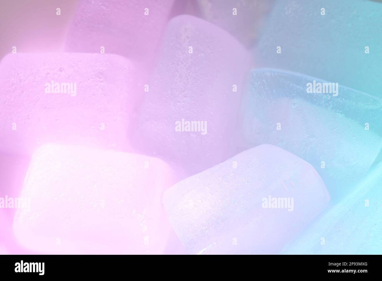 Ice cubes illuminated with blue and pink color light Stock Photo - Alamy