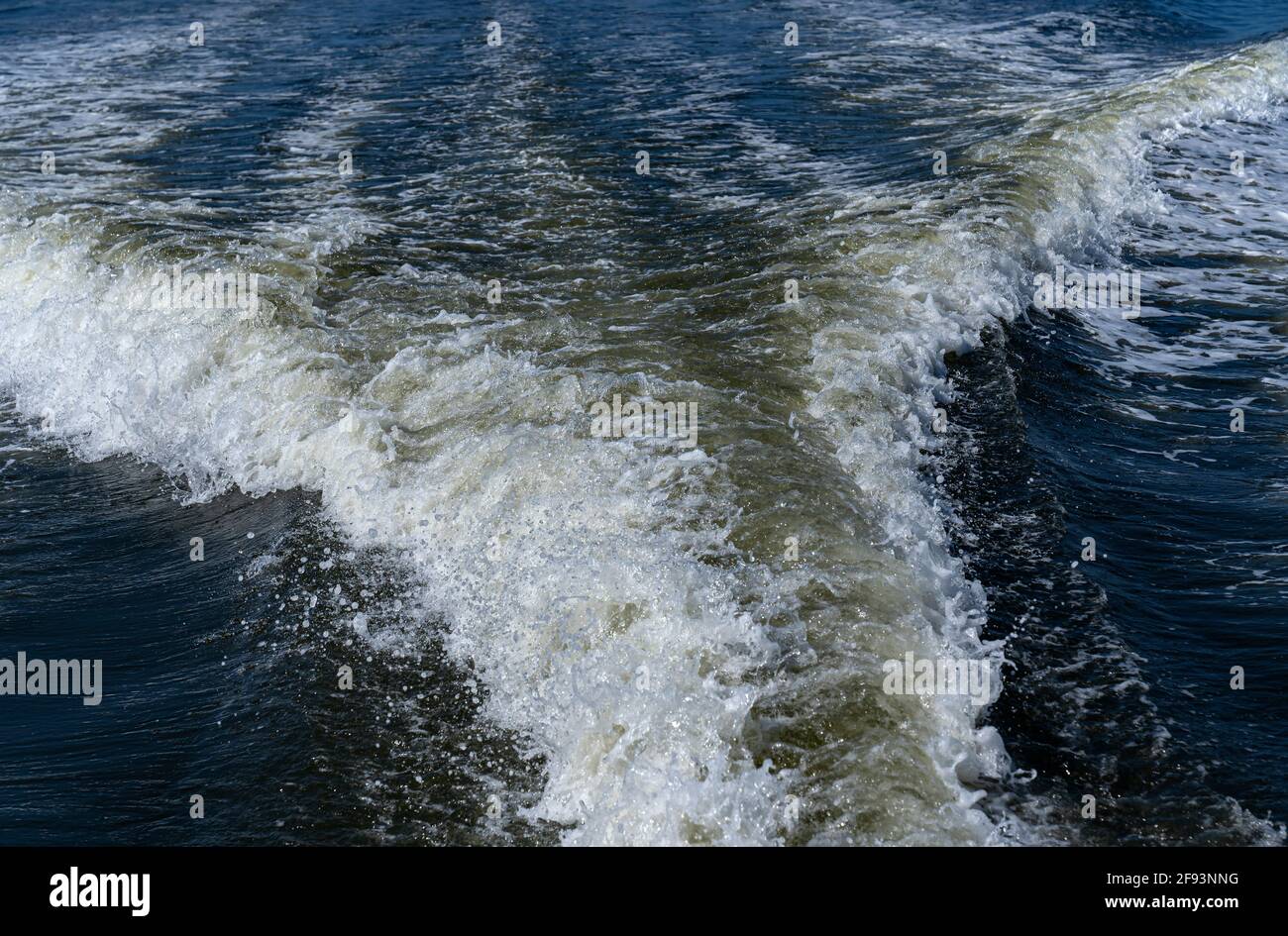 The trail on water surface behind of fast-moving motor boat Stock Photo ...