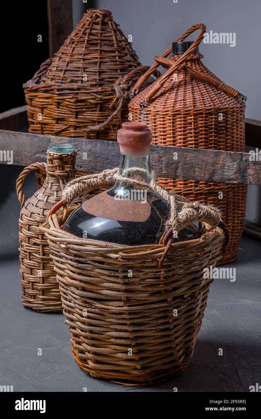 Vintage large wine bottles. Wine cellar, storage of wine Stock Photo