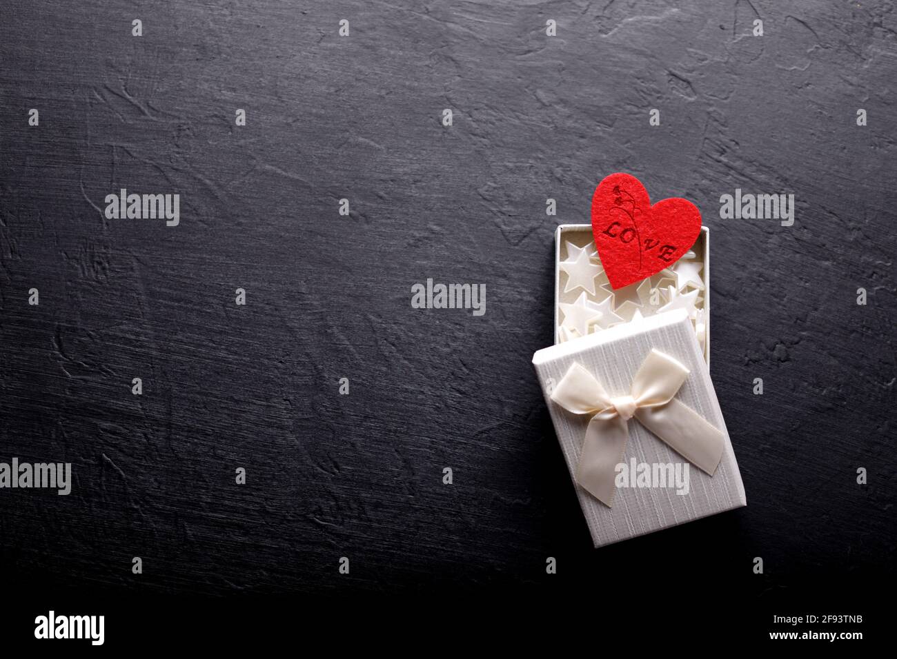 Beautiful valentines day background with red hearts on black background ...
