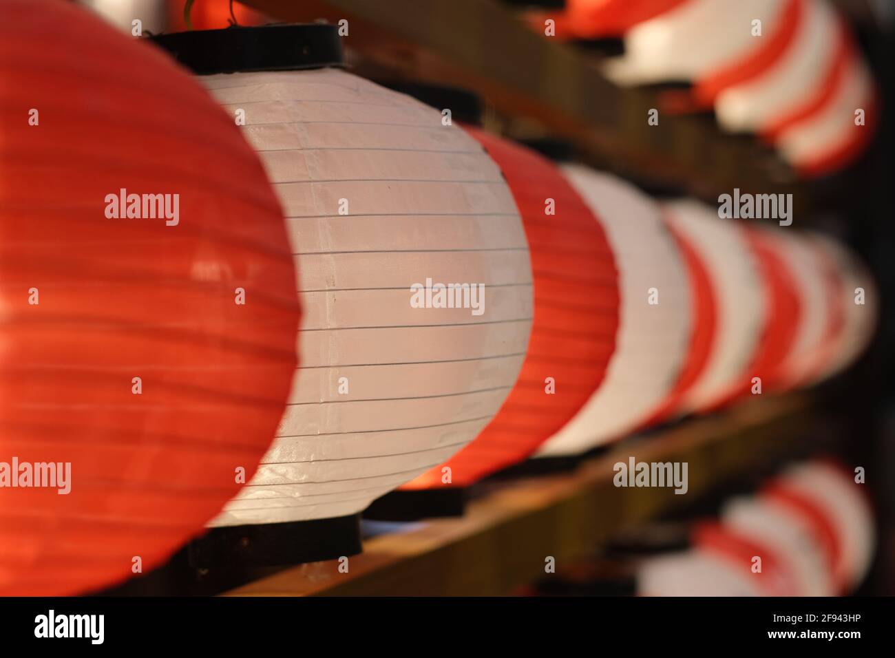 close up row of Japanese style paper lanterns. Traditional Japan red and white lantern. Japan culture concept Stock Photo