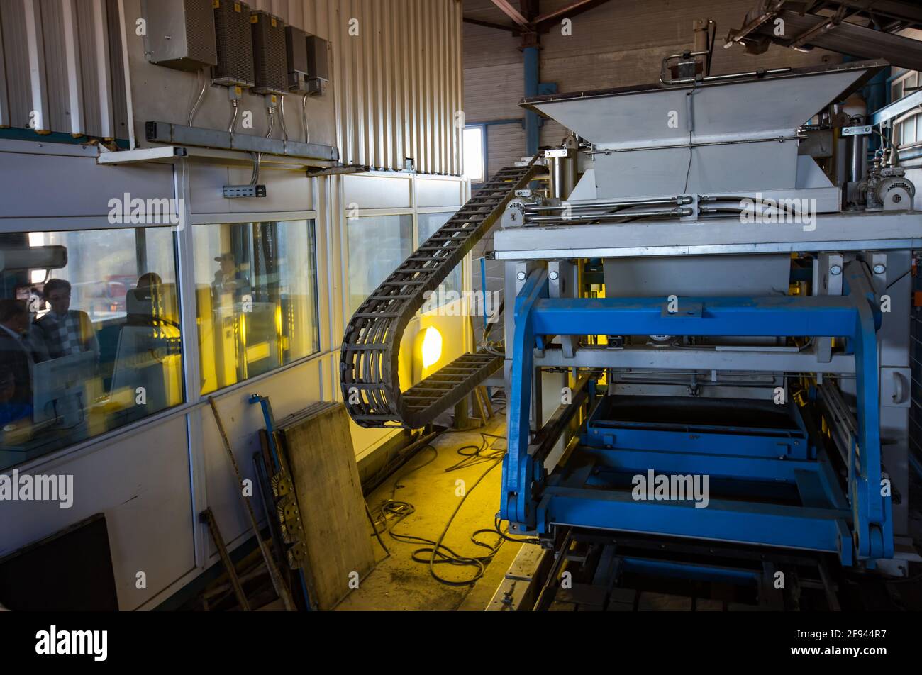 Paving tile production machine. Operators in control room left Stock ...