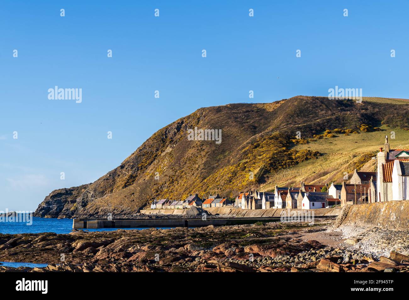 Crovie, Aberdeenshire, UK. 15th Apr, 2021. UK. This is the small old fishing village of Crovie which is directly on the shore. It was basking in the sun. Credit: JASPERIMAGE/Alamy Live News Stock Photo