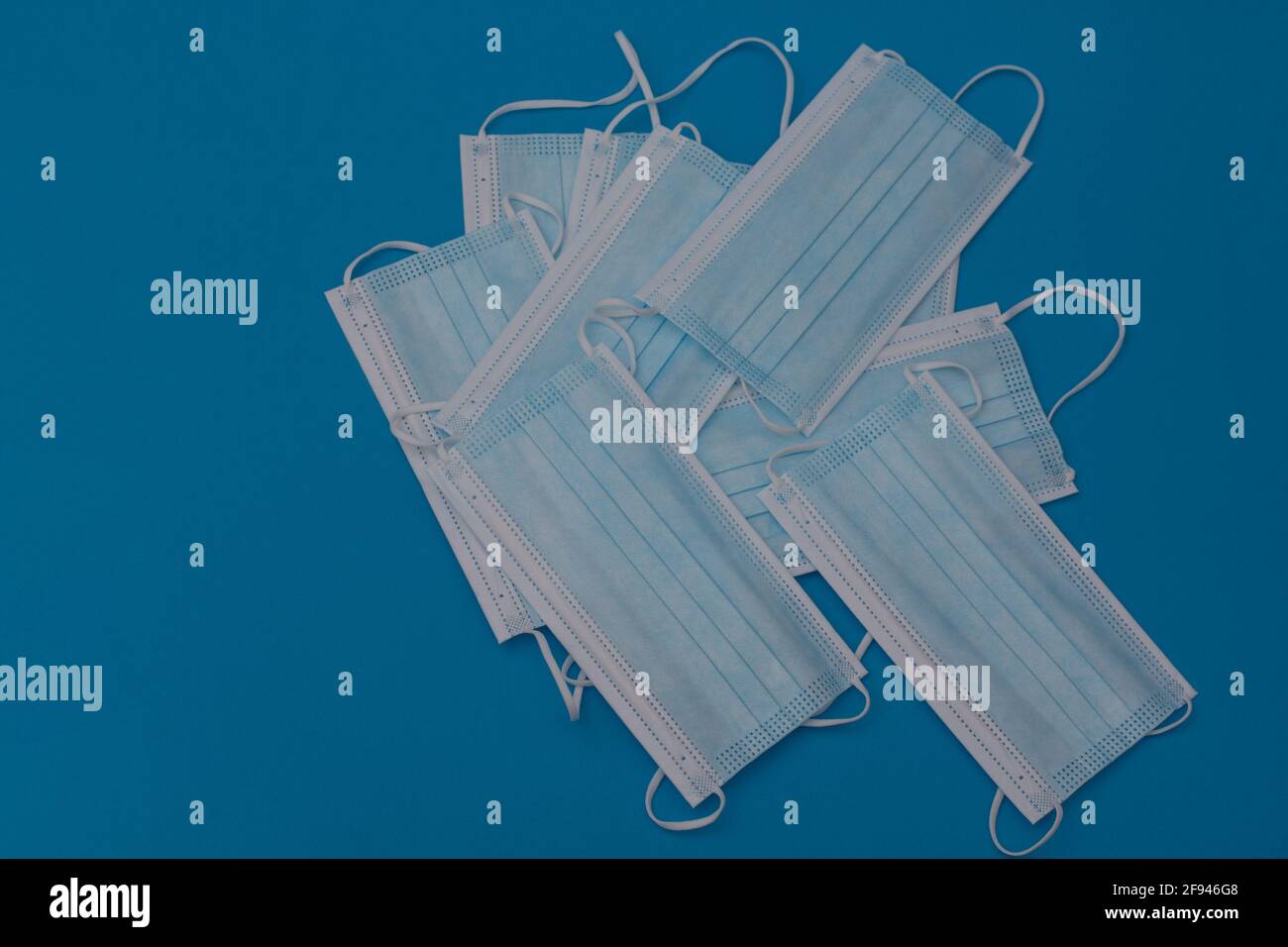 Protective face masks on a blue background. layout Stock Photo