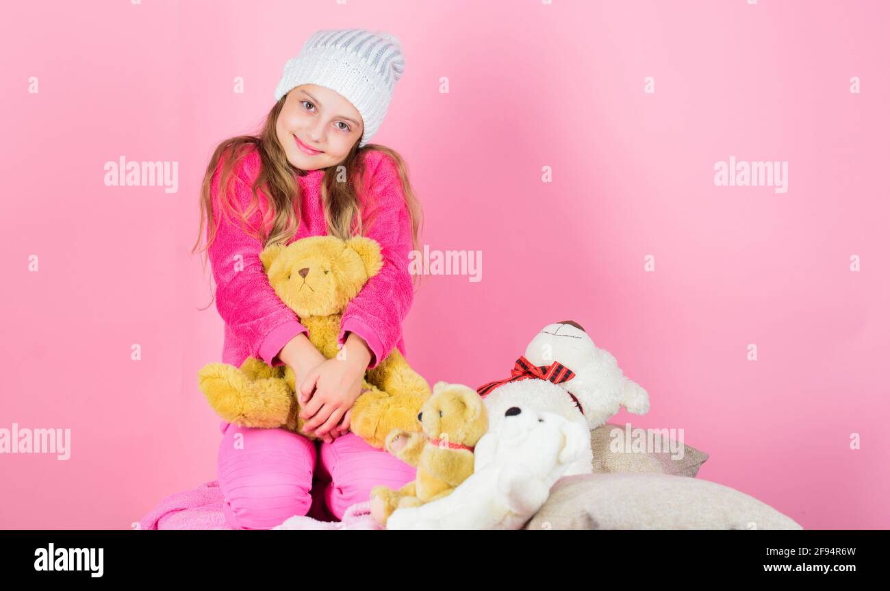 Unique attachments to stuffed animals. Kid little girl play with soft toy teddy bear pink