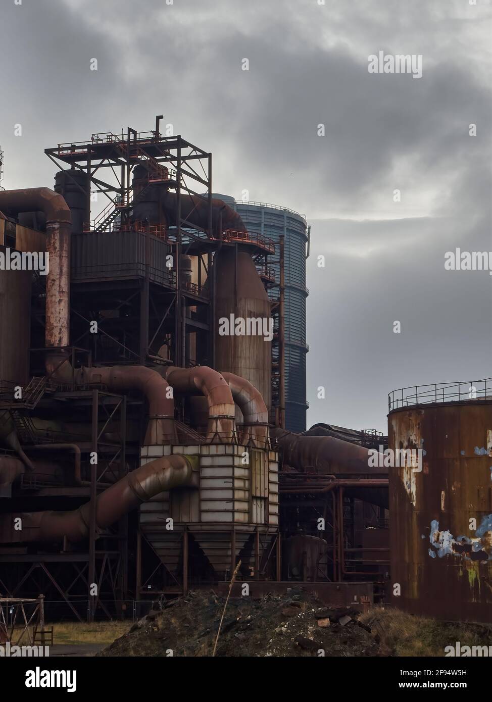 Detail from the now derelict Redcar Steelworks, showing a section of the blast furnace complex - huge rusted pipes and webs of support structures. Stock Photo