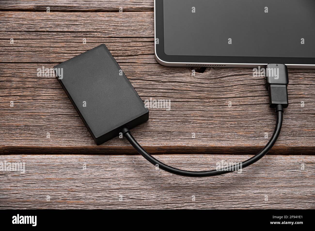 Memory card or external hard drive is connected to the Tablet PC Stock