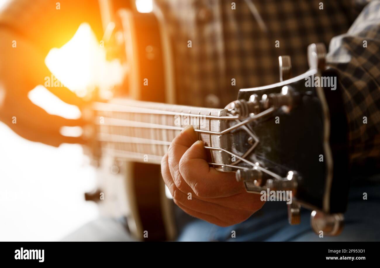 Musician playing electric guitar, close up. Stock Photo