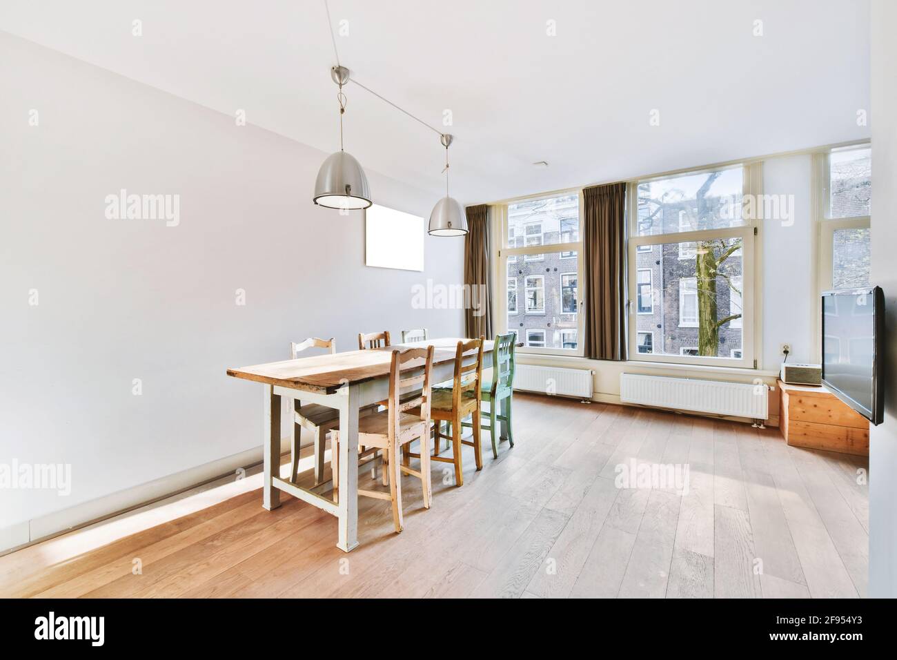 Minimalist style dining zone in modern apartment Stock Photo - Alamy