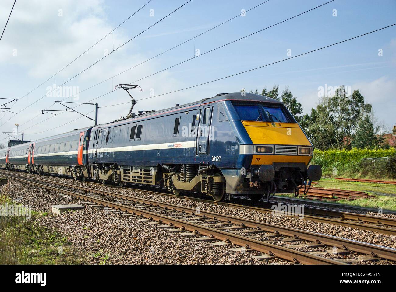 National Express East Coast main line high speed train passing Holme, Peterborough, Cambridge, UK. Class 91 electric multiple unit. Electrified line Stock Photo