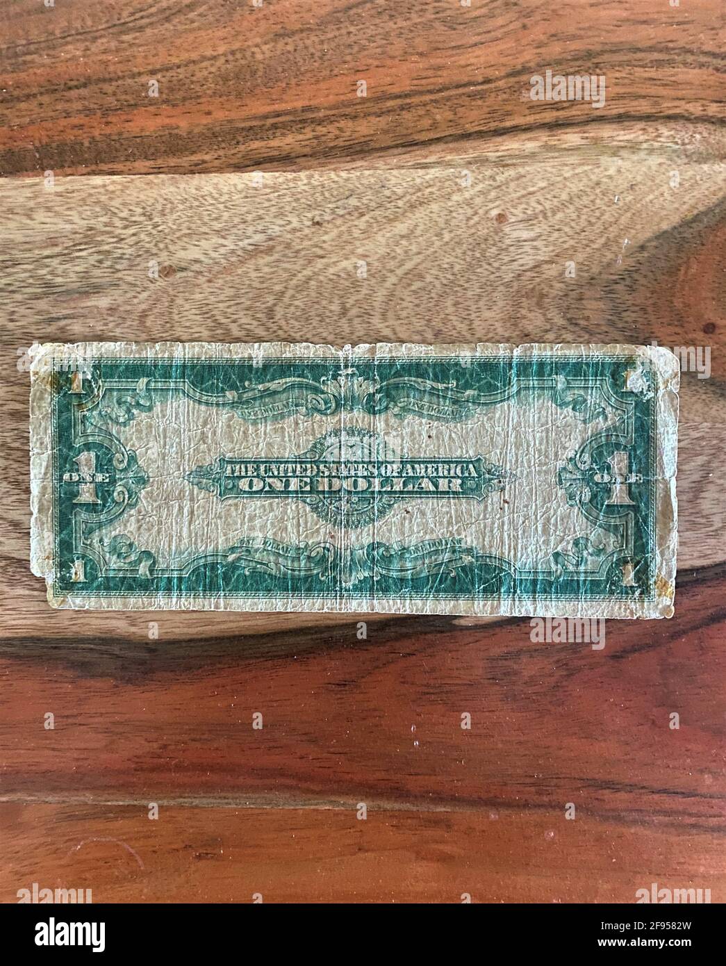 The back of an antique one dollar bill from 1923. Old dollar. Large bill. Stock Photo
