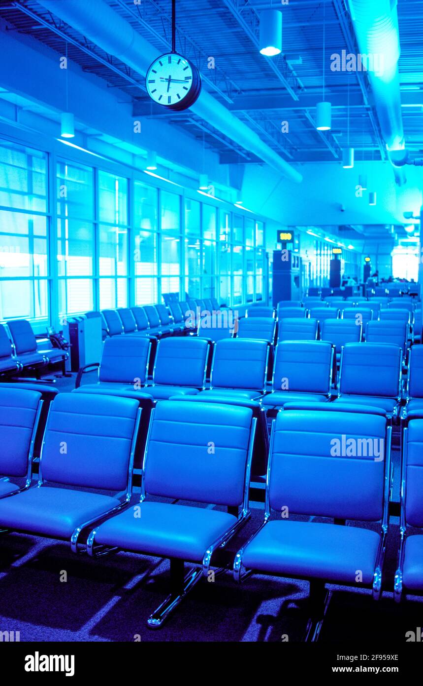 Canada, Ontario, Toronto. Pearson International Airport. Empty airport lounge with clock Stock Photo