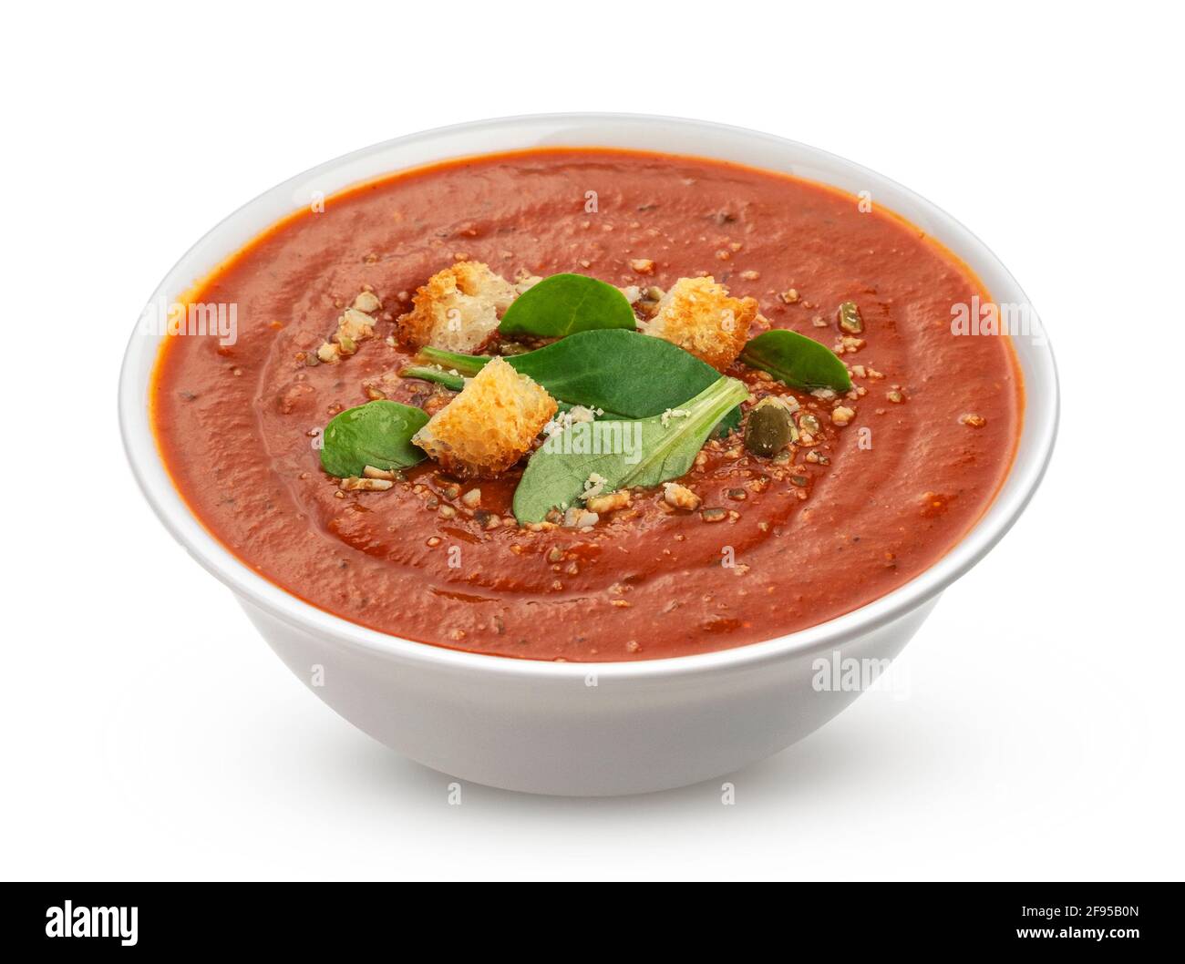 Bowl of tomato soup isolated on white background Stock Photo