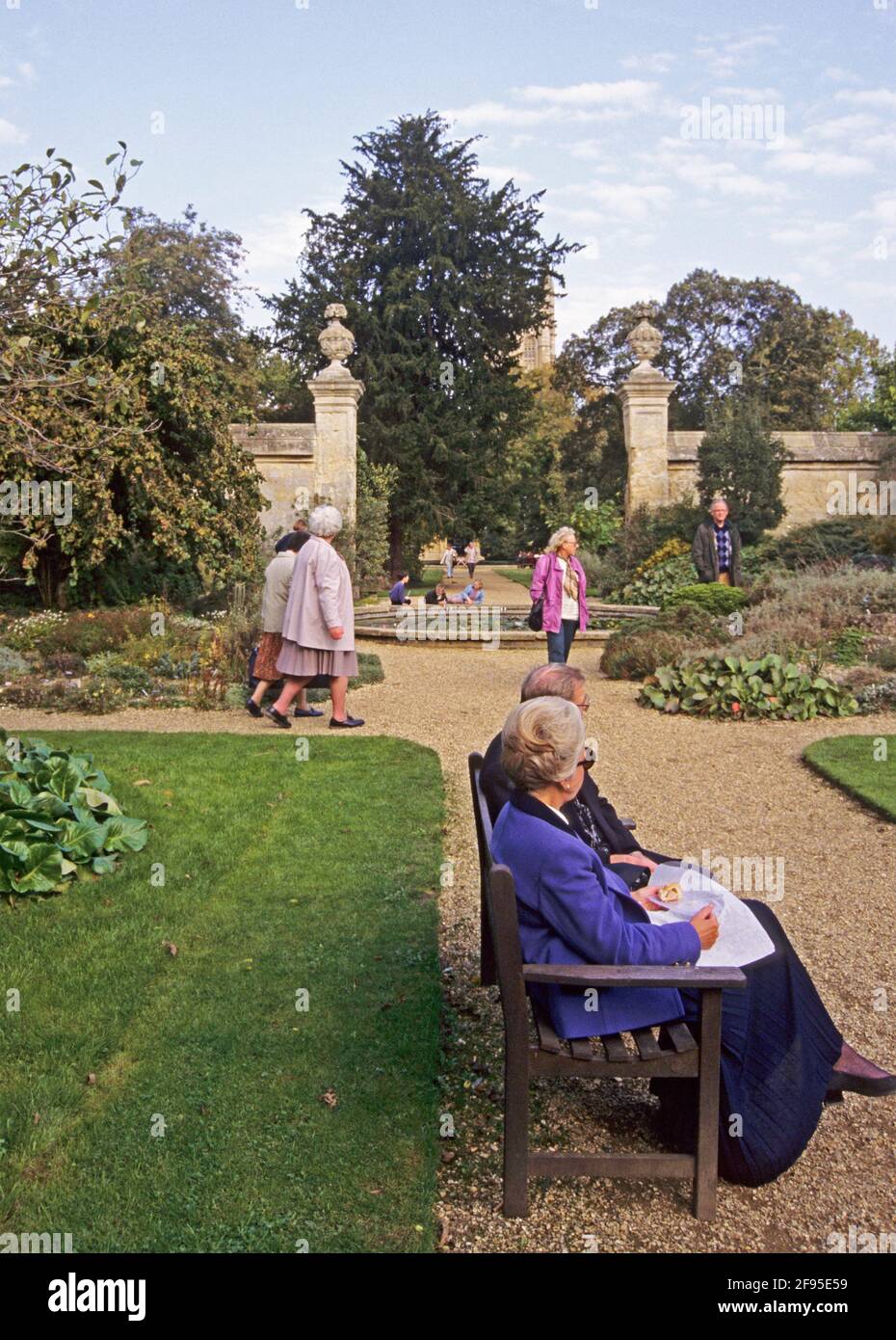 visitors and gate to the walled garden at the Botanical Gardens, Oxford University, Oxford, United Kingdom Stock Photo