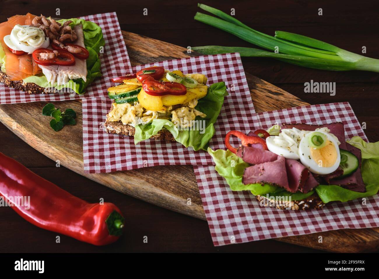 Variety of danish open sandwiches with eggs, seafood and roast beef