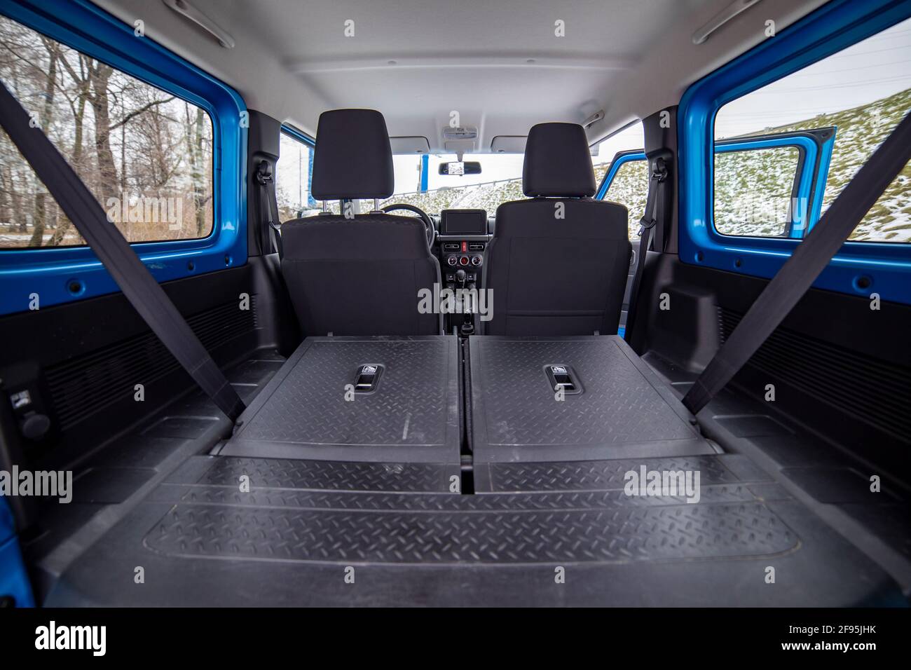 huge empty car trunk in interior of compact suv. rear seats in offroad suv car folded in flat flor. Stock Photo